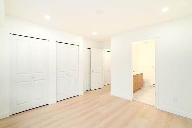 Unfurnished bedroom featuring baseboards, multiple closets, light wood-style flooring, and recessed lighting | Image 26