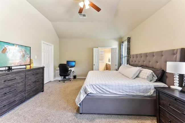 With room for a king bed, seating area, and more, this suite easily becomes your personal escape within the home | Image 17