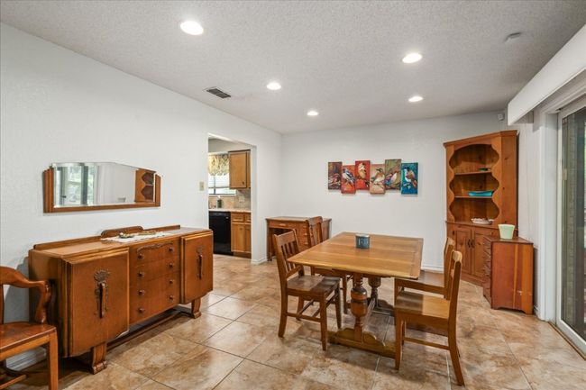 Dining area with recessed lighting, a textured ceiling, and light tile patterned floors | Image 11