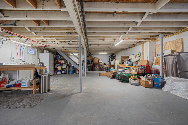 Basement featuring white fridge | Image 21