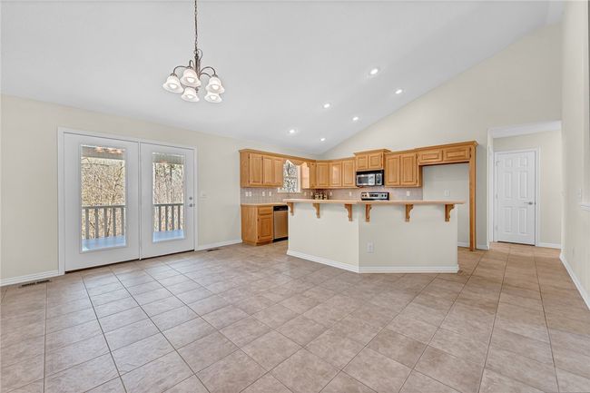 Large eat in kitchen. Hallway to split floor plan (2 bedrooms, 1 bathroom) | Image 6