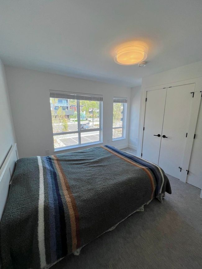 Bedroom with carpet and a closet | Image 20