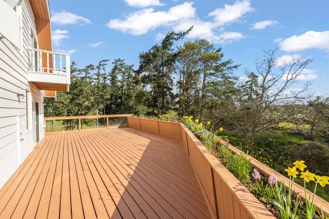 Deck featuring view of scattered trees | Image 5