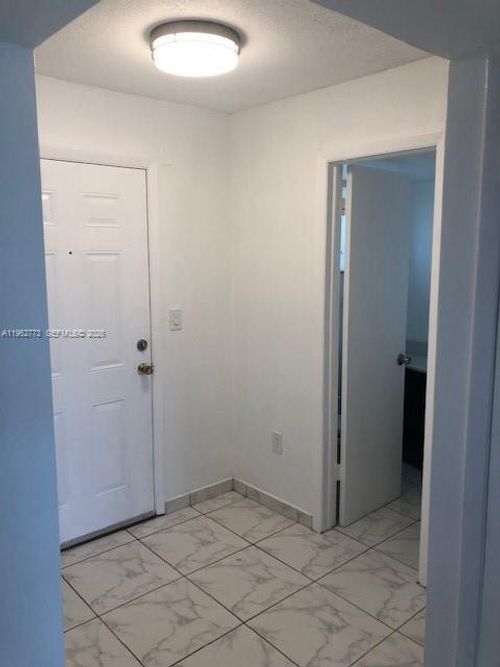 g411-1201 Ne 191st St, Miami, FL, 33179-4094 | Card Image