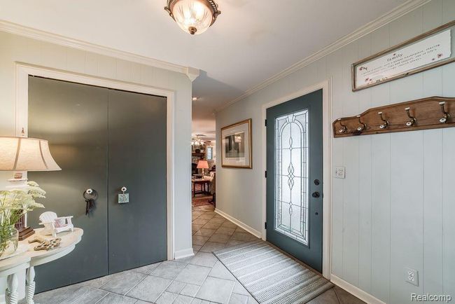 Expansive foyer with tile flooring and coat closet | Image 8