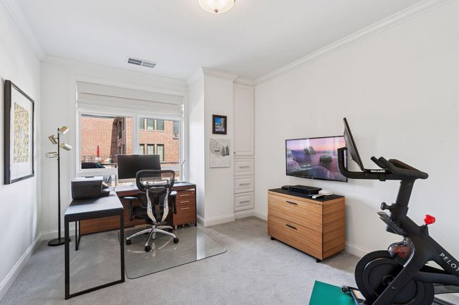The condo's 2nd bedroom is currently being used as a home office space | Image 21
