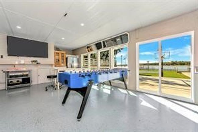 Playroom featuring recessed lighting and speckle patterned floor | Image 22