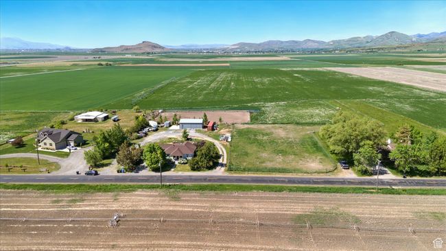 Overview of rural landscape featuring a mountain backdrop and farmland | Image 33