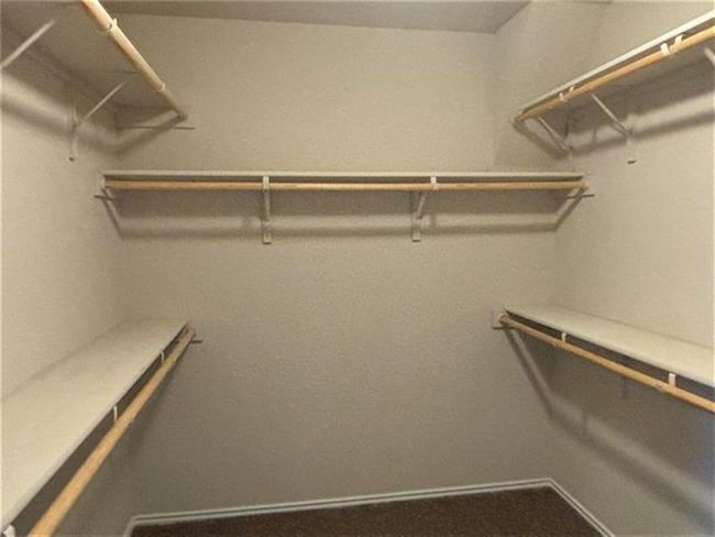 View of walk in closet | Image 10