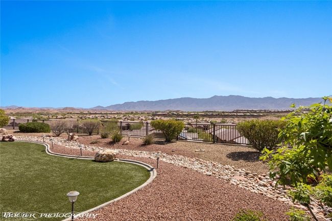 View of yard featuring a mountain view and fence | Image 66