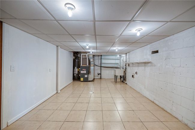 Laundry room in basement. | Image 19