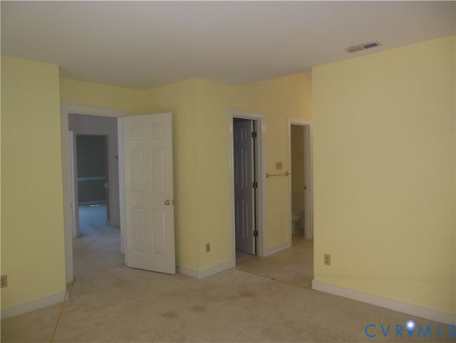 Primary Bedroom with Walk-In Closet and adjoining Bathroom | Image 17