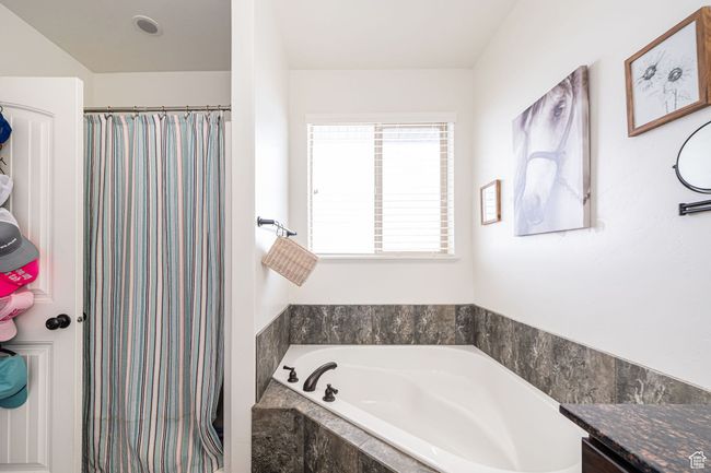 Full bath with a bath and a shower with shower curtain | Image 16