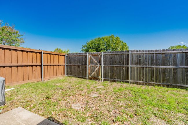 View of yard featuring a fenced backyard | Image 11