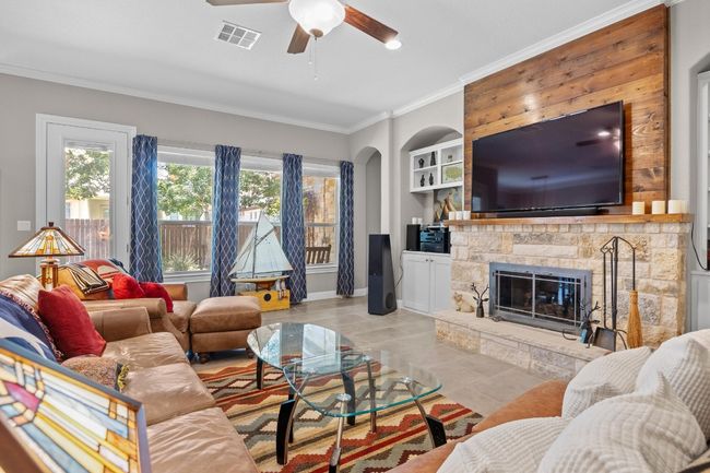 Open to the kitchen and dining, this is the kind of living room that keeps everyone connected without missing a moment | Image 10