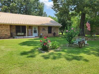 View of front of home with a front lawn and a porch | Image 2