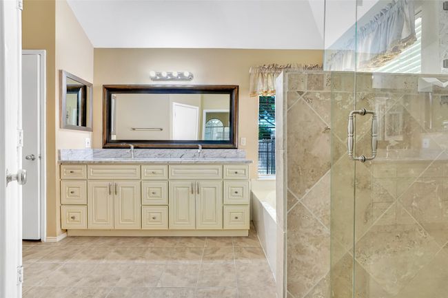 Bathroom featuring a healthy amount of sunlight, independent shower and bath, and tile floors | Image 32