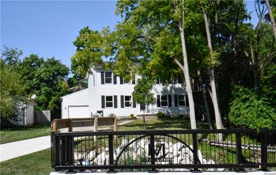 View of front of property with a front yard and a garage | Image 2