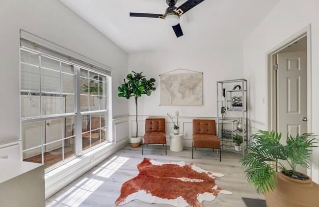 Unfurnished room featuring a wainscoted wall, ceiling fan, wood finished floors, and a decorative wall | Image 9