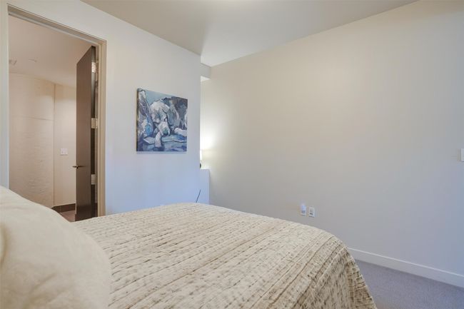 Bedroom with carpet flooring and baseboards | Image 25