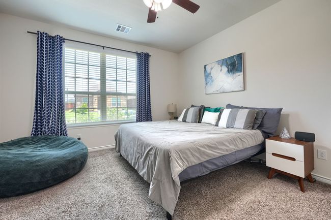Bedroom featuring carpet, baseboards, and a ceiling fan | Image 18