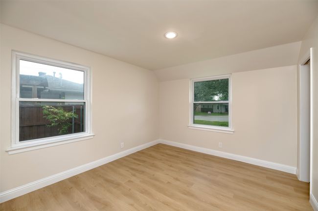 Empty room with light wood-type flooring, baseboards, plenty of natural light, and recessed lighting | Image 11