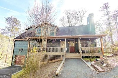 View of front facade featuring a garage and covered porch | Image 3