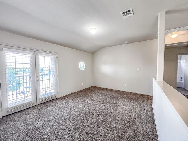 Carpeted empty room with french doors | Image 13