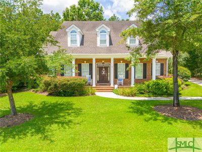 Large southern front porch. Perfect for a glass of sweet tea or other beverages of choice. | Image 2