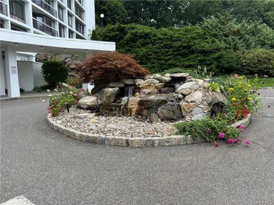 View of front rotary with waterfall. | Image 2