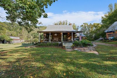 The "studio" was built in 2007, and is approximately 1080 sqft. This second home would make a perfect guest house, in-laws suite or short term rental! | Image 2