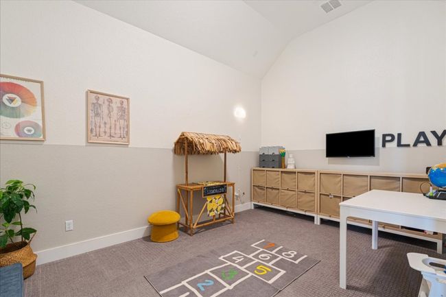 Home office with lofted ceiling, carpet, and baseboards | Image 9