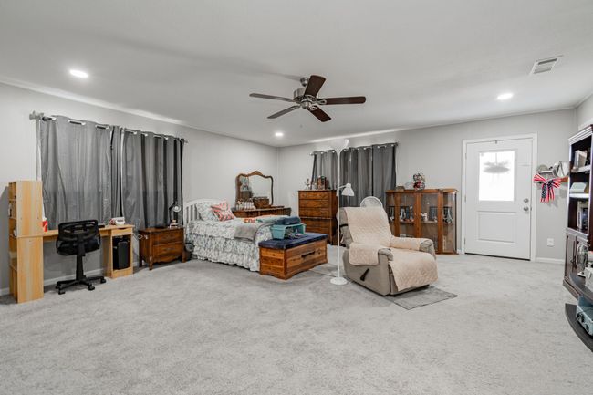 Carpeted bedroom with ceiling fan | Image 7