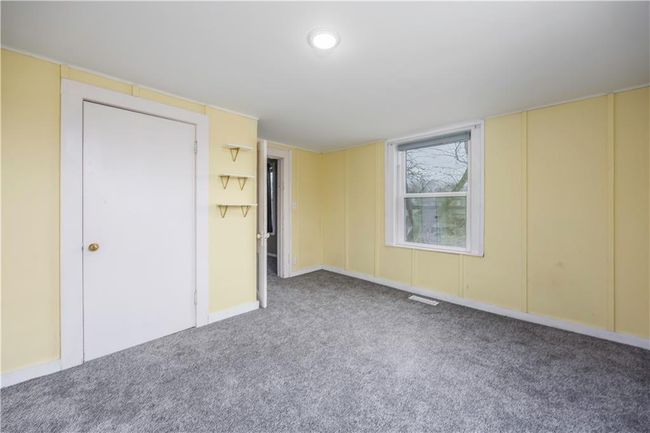Empty room featuring carpet flooring and visible vents | Image 56