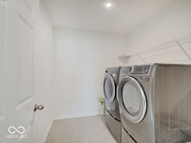 Laundry room w/ ceramic tile floor & included washer & dryer set | Image 22
