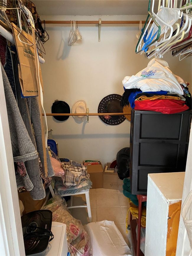 Spacious closet featuring tile patterned floors | Image 23