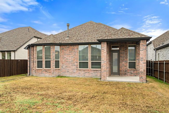 Rear view of house featuring a patio and a yard | Image 23