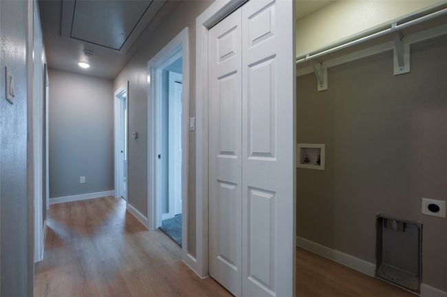 Hall with wood finished floors and attic access | Image 30
