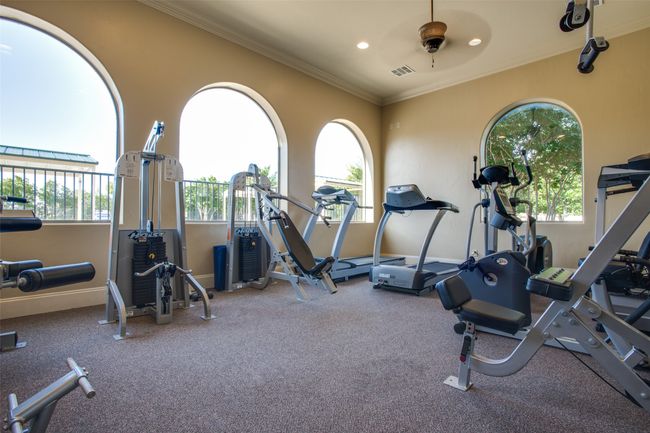 Exercise room with recessed lighting, visible vents, baseboards, and ornamental molding | Image 24