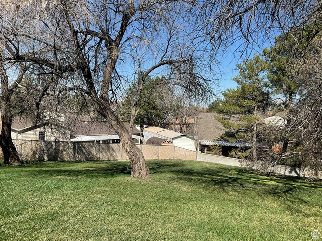 View of yard featuring fence | Image 6