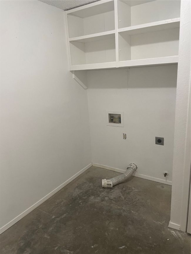 Clothes washing area featuring washer hookup and hookup for an electric dryer | Image 22