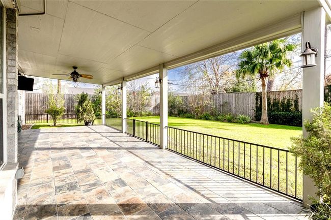Expansive fenced yard with endless potential. This oversized yard offers room to add a pool, create the ultimate entertaining space, or simply enjoy the outdoors. Bonus: it already includes a covered patio for shaded relaxation year-round. | Image 38
