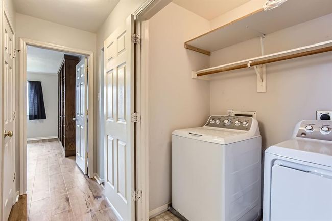 Laundry room with plenty of shelving. | Image 34