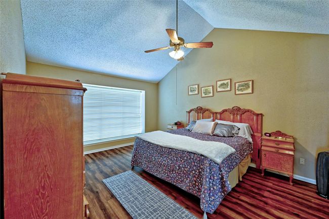 Spacious primary bedroom with soaring ceilings. | Image 19