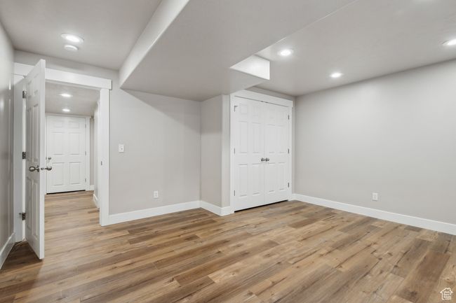 Basement featuring hardwood / wood-style flooring | Image 37