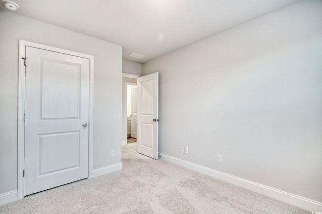 Unfurnished bedroom featuring light carpet | Image 27
