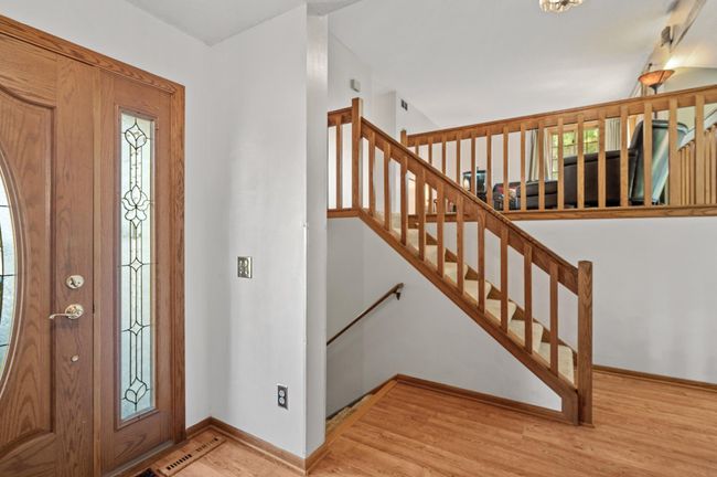 The abundant natural light adds a warm and inviting touch to this large foyer. | Image 5