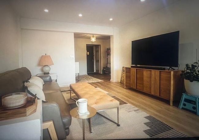 Living area featuring light wood-style floors, recessed lighting, and baseboards | Image 14