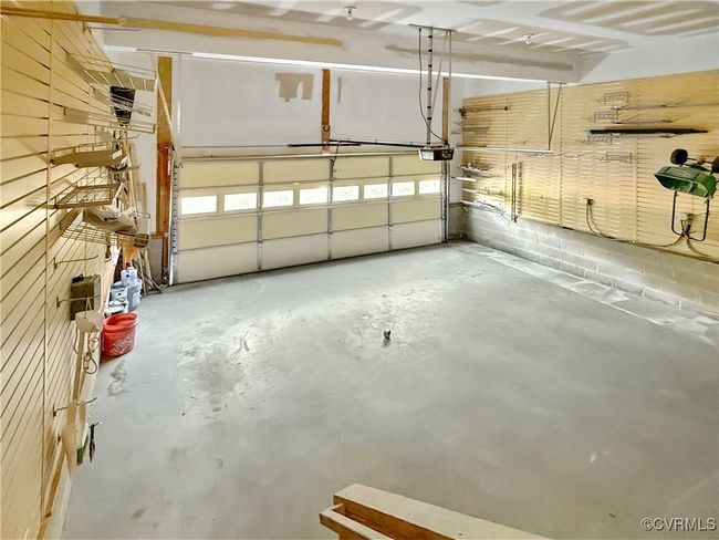 Garage with a garage door opener | Image 21