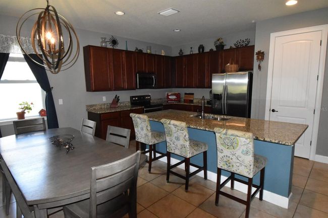 709 Calabria Way, House other with 3 bedrooms, 3 bathrooms and null parking in HOWEY IN THE HILLS FL | Image 14